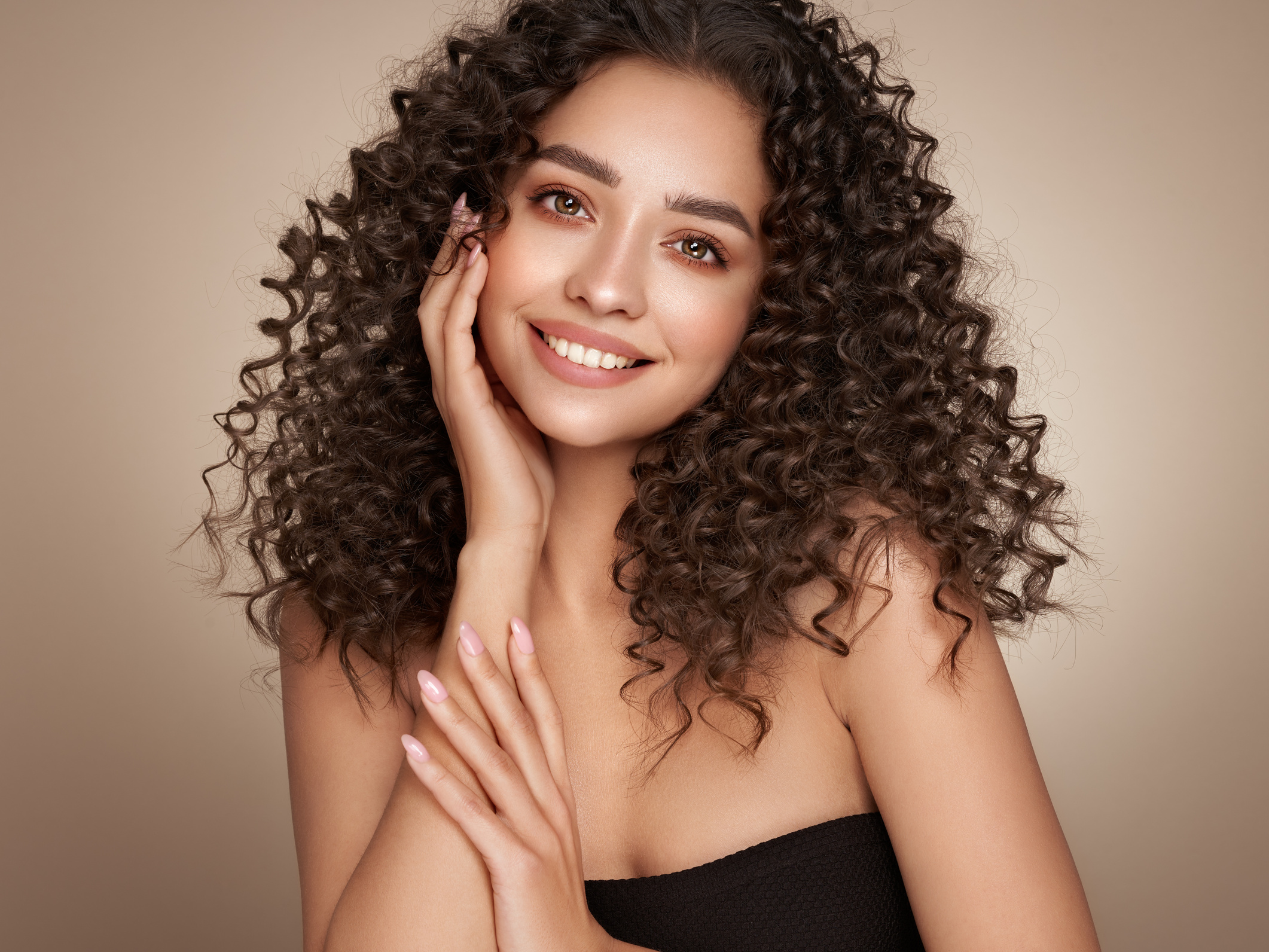 Beautiful smiling woman with afro curls